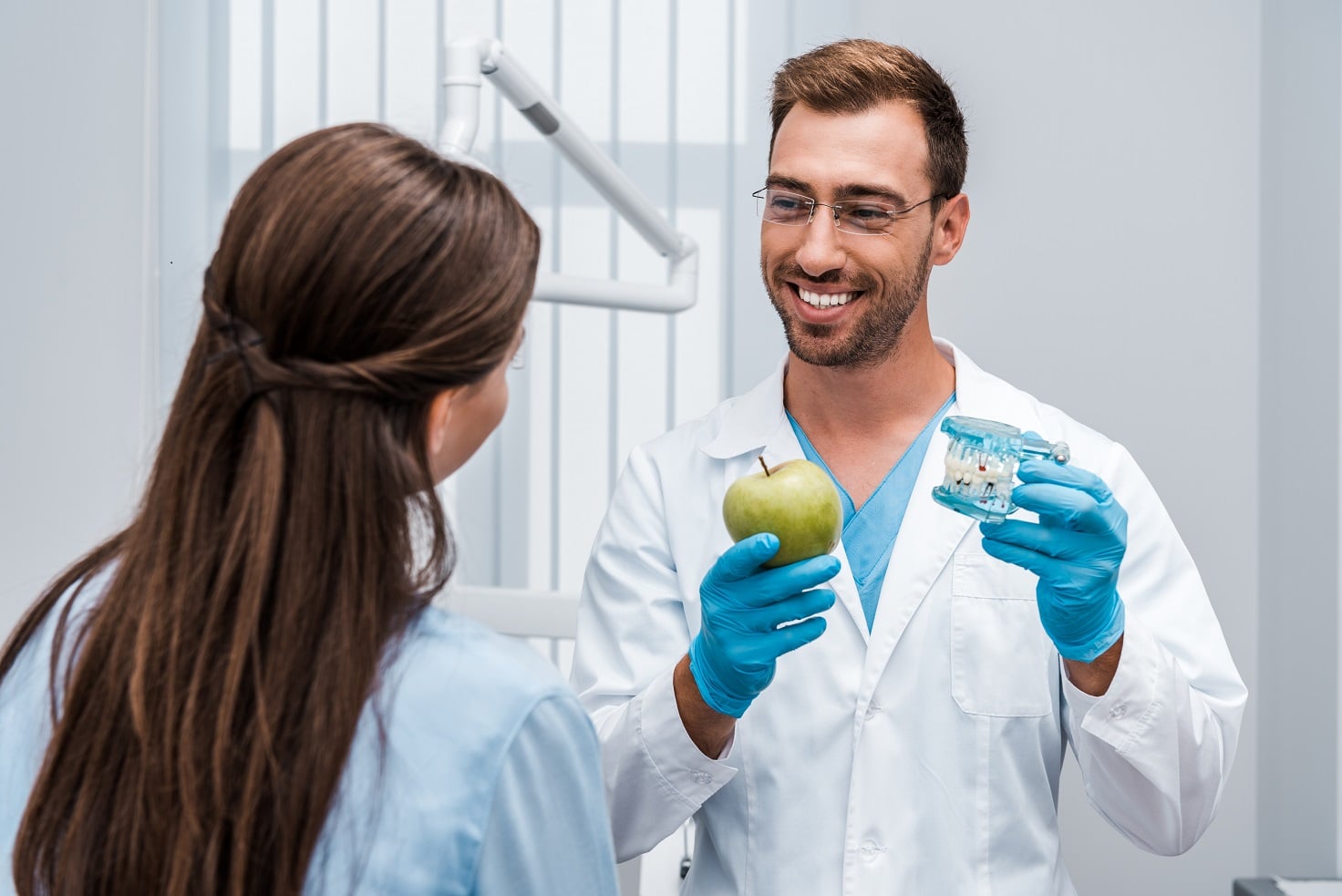 Dentist explaining a process to