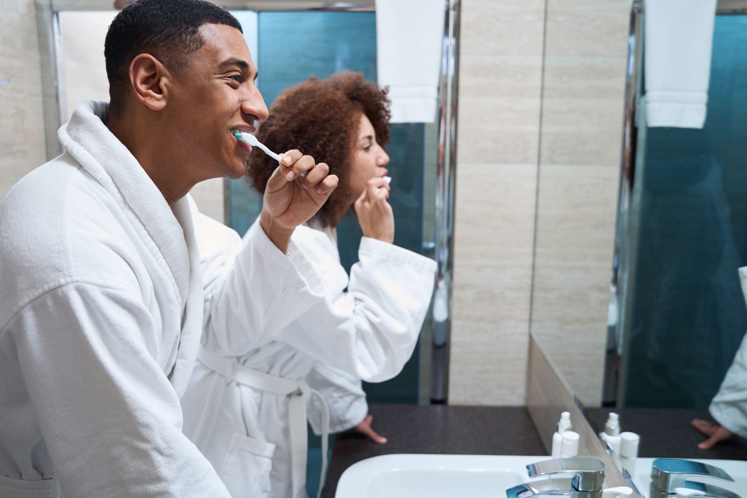 man-and-a-woman-brush-teeth