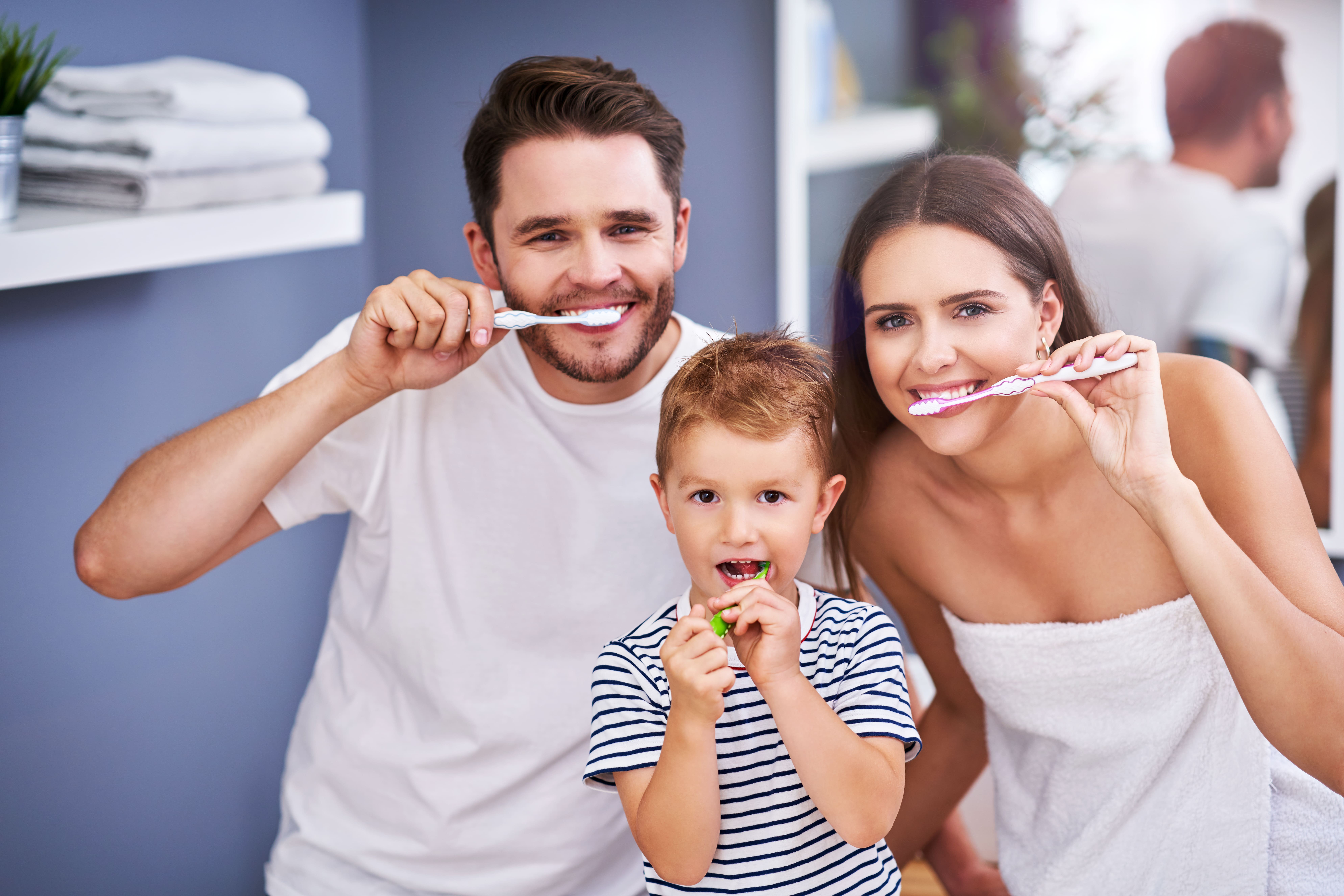 portrait-of-happy-family-brushing-teeth-in-the-bat-2022-05-18-21-22-43-utc(1)